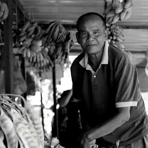 Man working at a fruit shop.