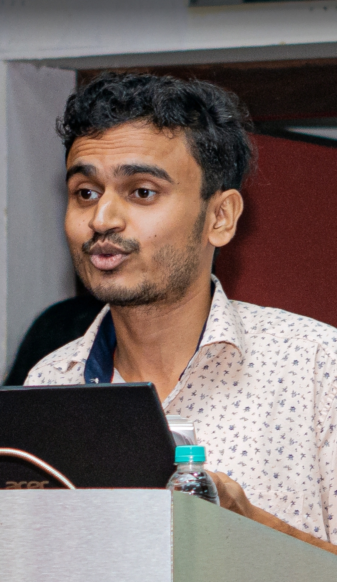 Puneet Singh Singhal Talking at a conference.