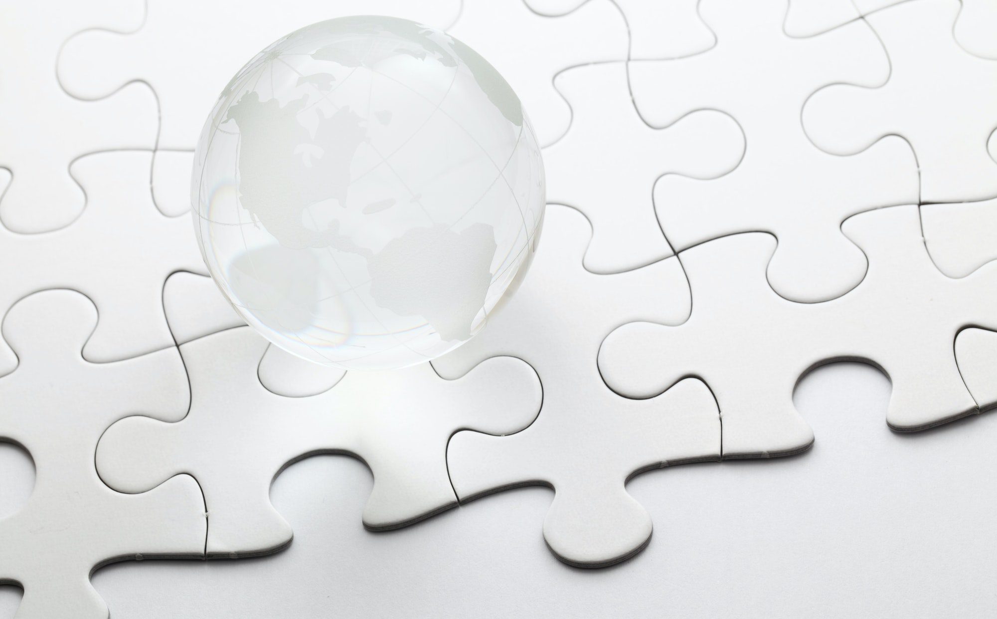Glass globe ball with puzzle background
